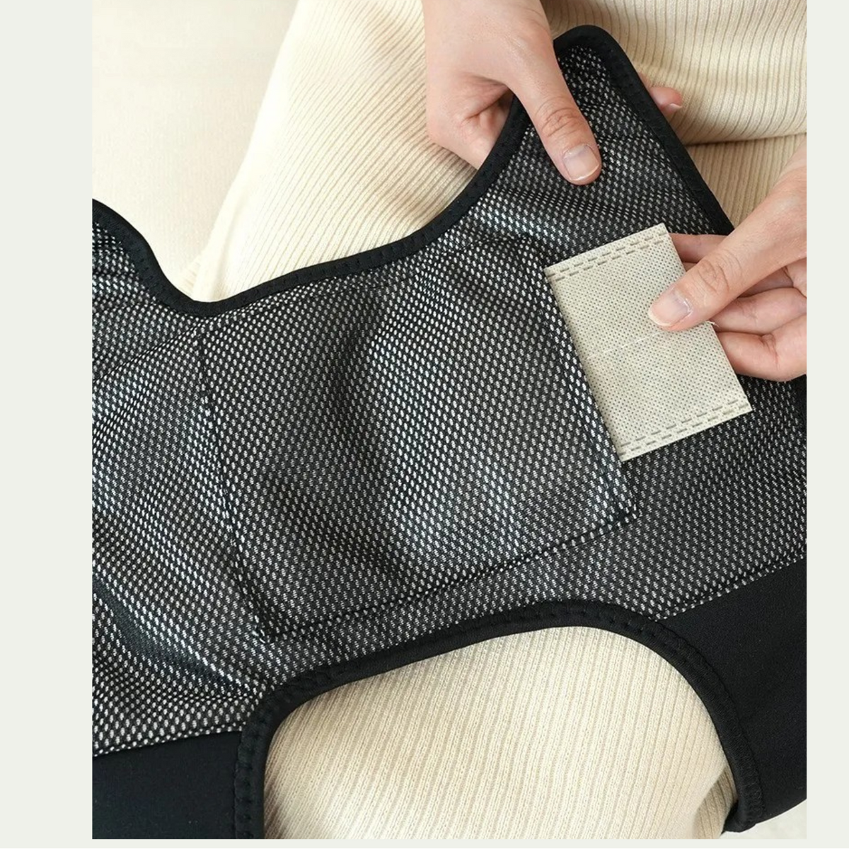 Luliqua KneeRelief breathable mesh fabric with herbal moxa pad pocket - black honeycomb mesh design allows air circulation, beige herbal moxibustion patch placement for comfortable all-day wear
