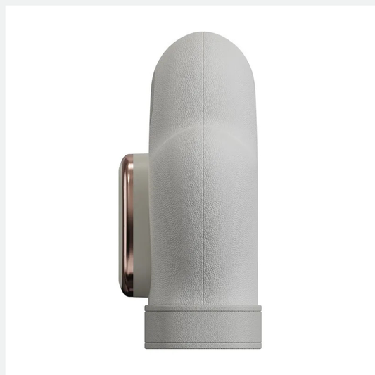 Luliqua HandRelief Pro gray hand massager side view - gray textured fabric exterior with rounded capsule shape, rose gold metallic control panel on side with 4 buttons, vertical center seam line, horizontal band near bottom, ergonomic mitten design for complete hand coverage