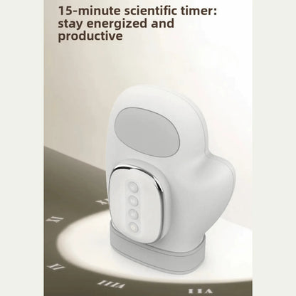 Luliqua HandRelief Pro 15-minute scientific timer for energized productivity - white hand massager with gray oval display window on top, white rounded control panel with chrome border showing 4 circular buttons, placed on white hand-shaped charging mat with gray base, natural lighting casting shadows, text reads 15-minute scientific timer stay energized and productive