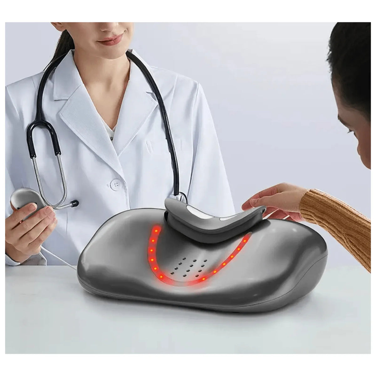 Luliqua CervicalRelief gray ergonomic cervical traction pillow - doctor demonstrating device with adjustable neck strap, infrared heat nodes glowing red, ventilation holes for breathability